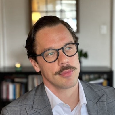 portrait photo of Greg Hudson