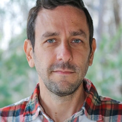 portrait photo of Evan Friss