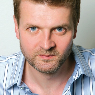 portrait photo of Adam Taor