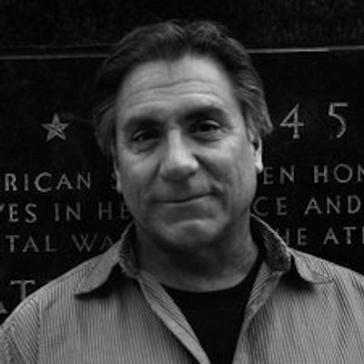 portrait photo of Sam Moses