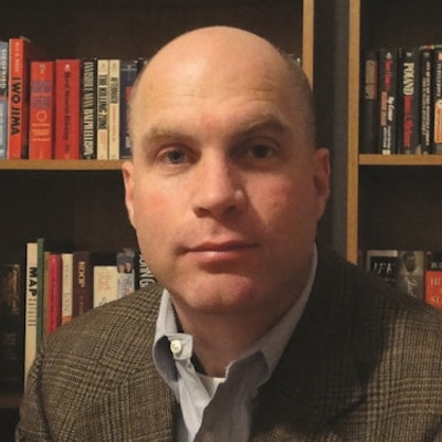portrait photo of John C. McManus